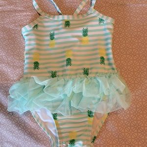 Size 6-9mo  green striped pineapple swimsuit